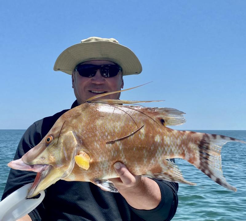 Angler holding a Snook caught in the Florida Keys
