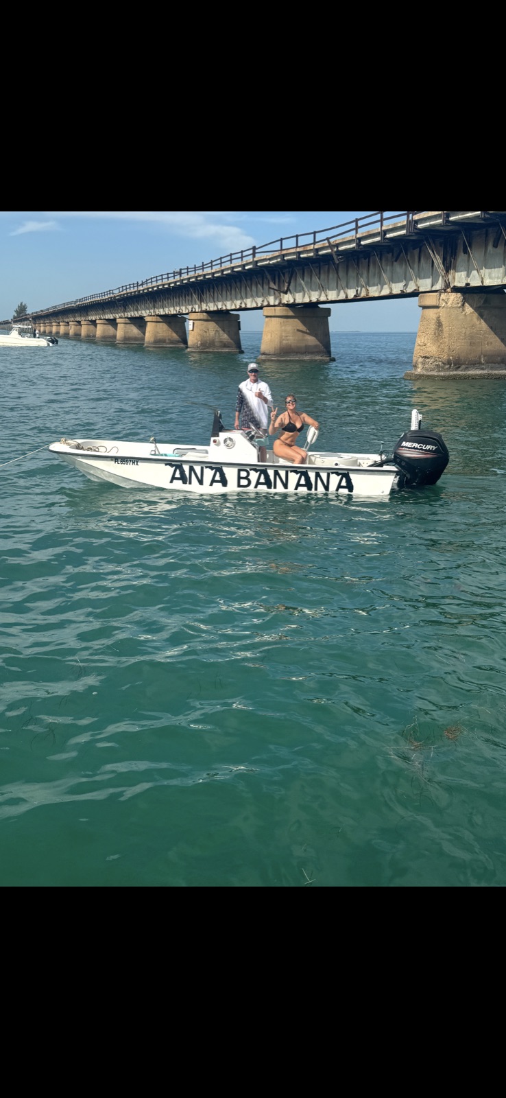 17-foot white Mako skiff with hand-painted Ana Banana lettering near the 7 Mile Bridge