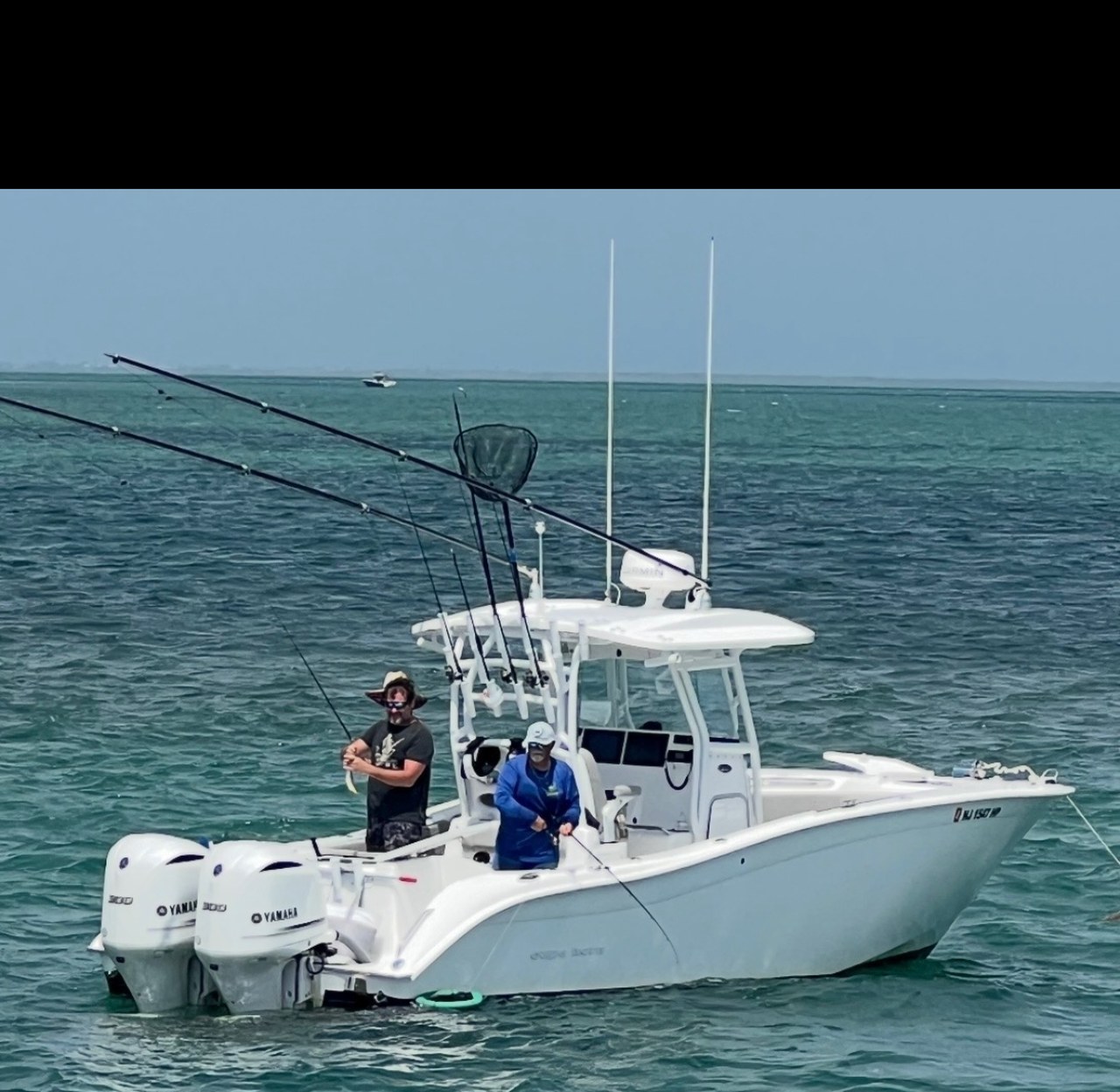 32-foot Cape Horn center console with twin Yamaha 300hp engines and two anglers on the Florida Keys flats