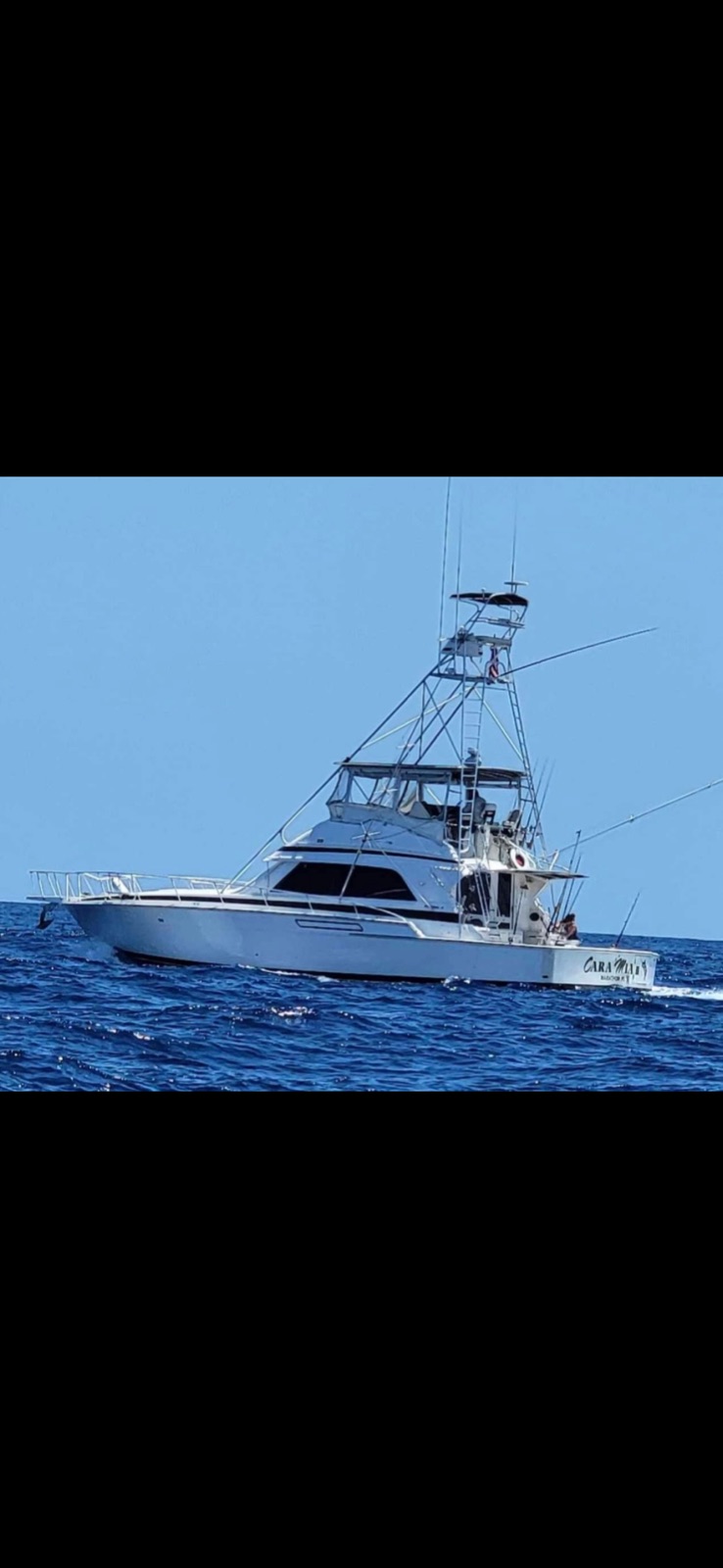 50-foot Bertram sportfish with twin tower in deep blue offshore water, Marathon FL