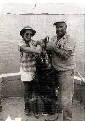 Vintage family photo holding a goliath grouper